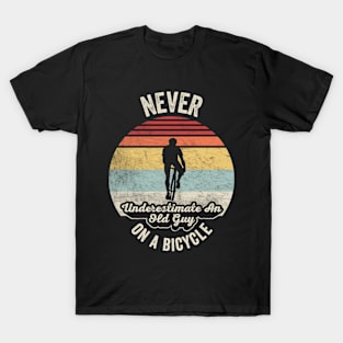 Never Underestimate An Old Guy On A Bicycle Funny Cycling Vintage Biker Cyclist Dad Gift Biker Gift Retro Bike T-Shirt